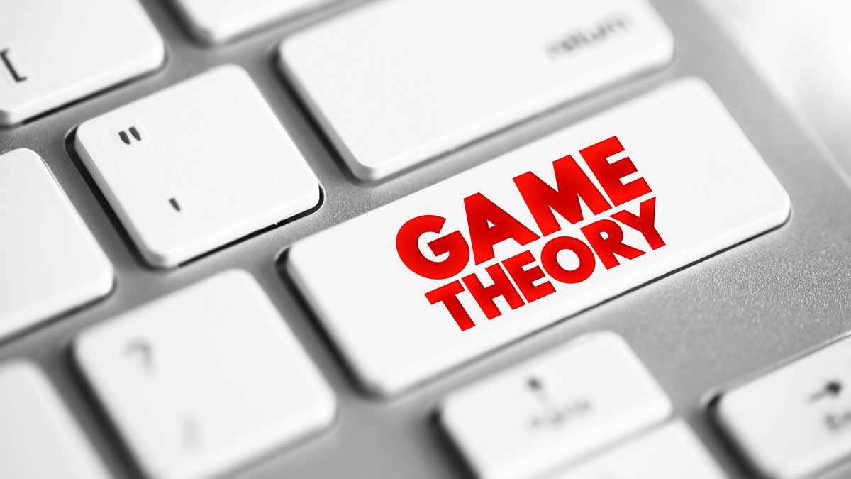 A close-up of a white computer keyboard features one key boldly labeled GAME THEORY in red letters, visually emphasizing the importance of game theory as if it were just a button press away. - Best Online Poker Sites 2025 poker game theory
