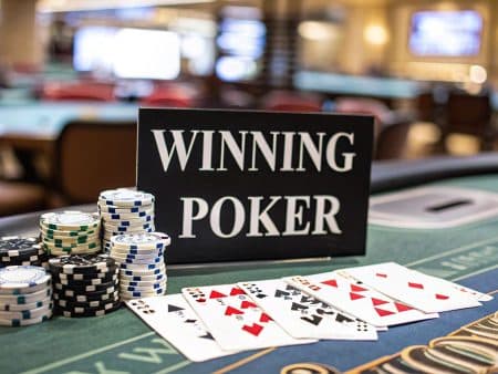 A poker table with stacks of chips, playing cards showing a full house and two pair, and a sign that reads WINNING POKER. The background shows more tables in a casino setting.